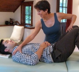 Mary Naden gives table work during an Alexander Technique lesson in Takoma Park, MD